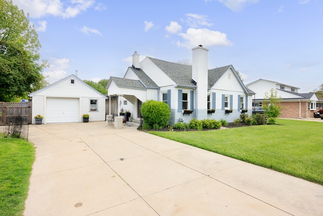 22019 Violet St, Saint Clair Shores, MI 48082 - view of front of property featuring concrete driveway, a chimney, an outdoor structure, a detached garage, and brick siding