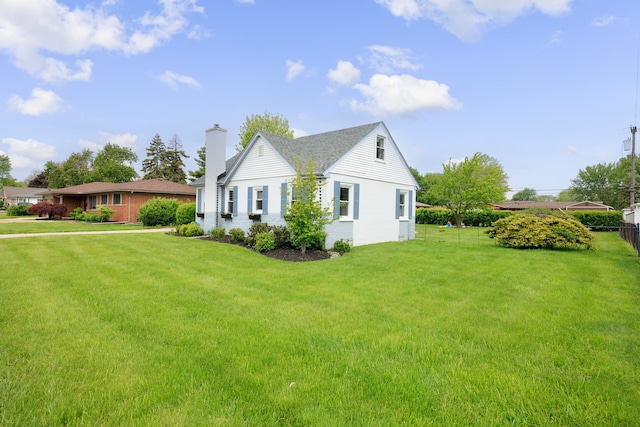 22019 Violet St, Saint Clair Shores, MI 48082 - view of side of property with a chimney and brick siding