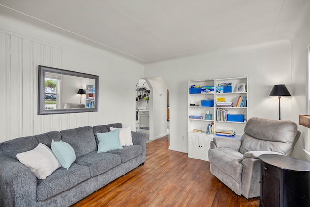 22019 Violet St, Saint Clair Shores, MI 48082 - living room with wood finished floors, arched walkways, and baseboards