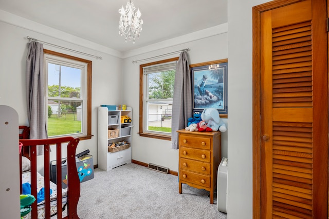 22019 Violet St, Saint Clair Shores, MI 48082 - carpeted bedroom featuring multiple windows, a chandelier, and baseboards