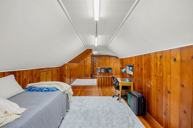 22019 Violet St, Saint Clair Shores, MI 48082 - bedroom featuring wood finished floors, wooden walls, and vaulted ceiling