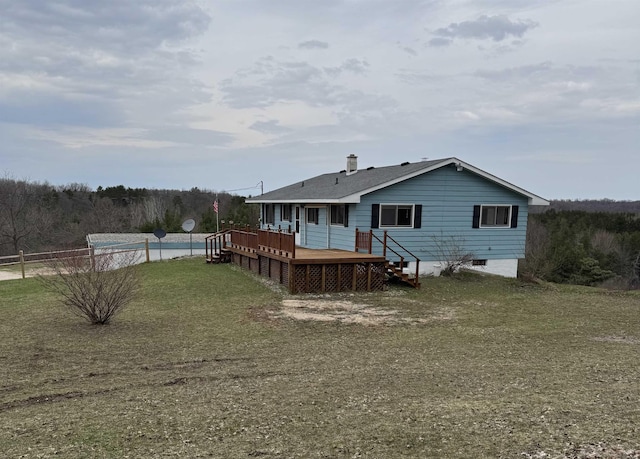 3135 Montgomery Rd, Bellaire, MI 49615 - back of property featuring a deck