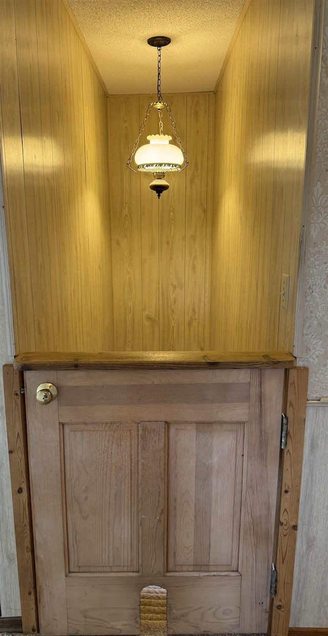 3135 Montgomery Rd, Bellaire, MI 49615 - detailed view of wooden walls and a textured ceiling