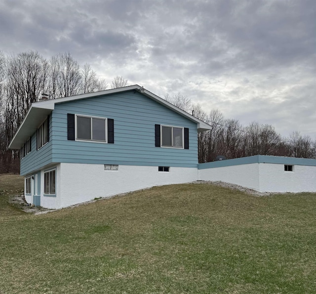 3135 Montgomery Rd, Bellaire, MI 49615 - view of property exterior featuring a yard