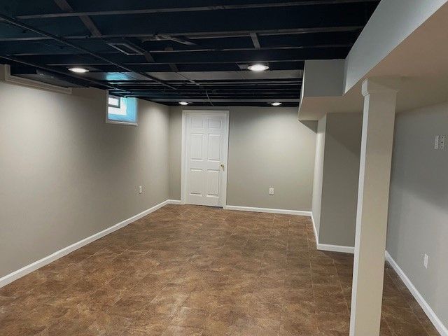 basement featuring baseboards