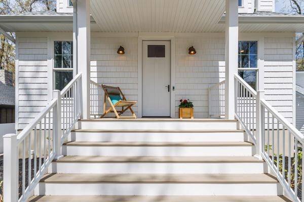 4108 Chippewa Trl, New Buffalo, MI 49117 - doorway to property with covered porch and a shingled roof