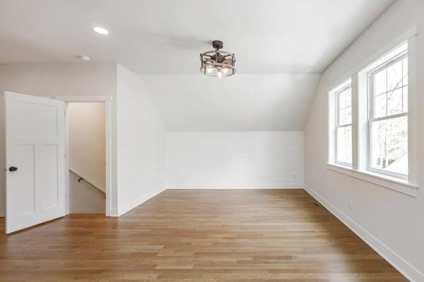 4108 Chippewa Trl, New Buffalo, MI 49117 - bonus room with vaulted ceiling, light wood-style flooring, baseboards, recessed lighting, and a chandelier