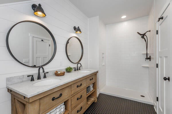 4108 Chippewa Trl, New Buffalo, MI 49117 - full bath with double vanity, a tile shower, and tile patterned floors