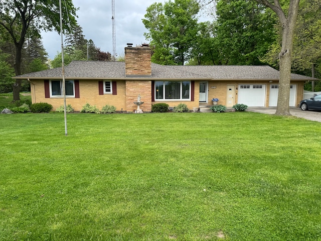 2071 N Belsay Rd, Burton, MI 48509 - single story home with a chimney, concrete driveway, a front lawn, and a garage