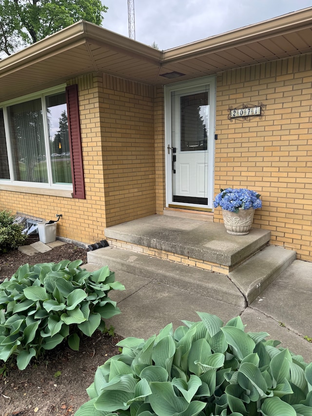 2071 N Belsay Rd, Burton, MI 48509 - property entrance with brick siding