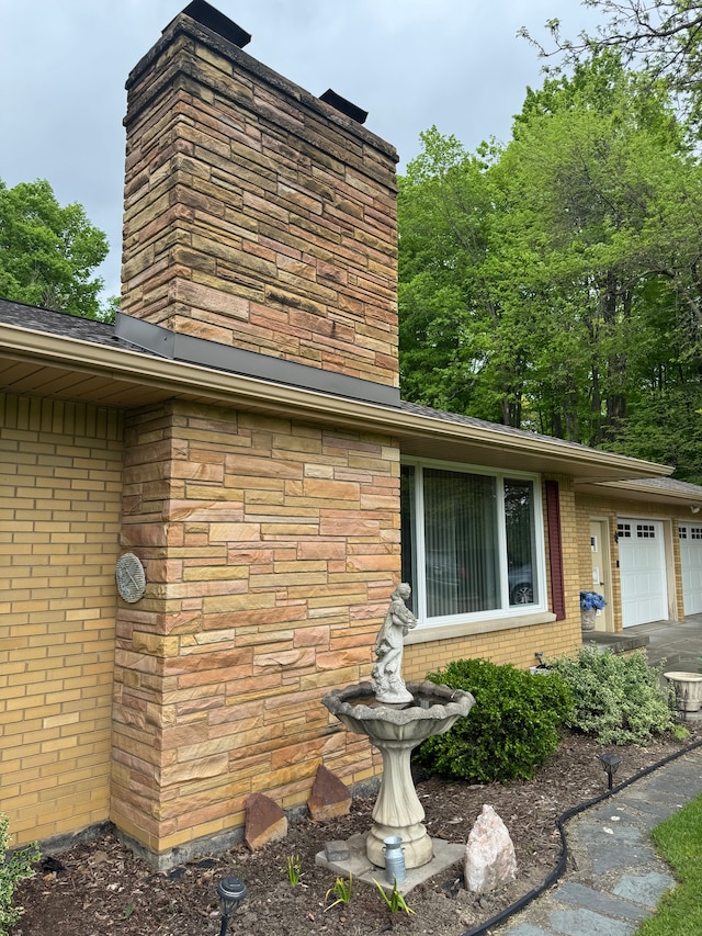 2071 N Belsay Rd, Burton, MI 48509 - exterior view of a chimney and brick siding