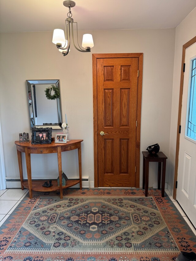 2071 N Belsay Rd, Burton, MI 48509 - tiled foyer featuring a chandelier and baseboards
