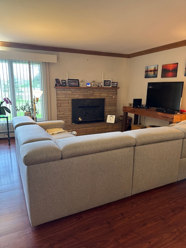 2071 N Belsay Rd, Burton, MI 48509 - living area featuring wood finished floors, a stone fireplace, and ornamental molding