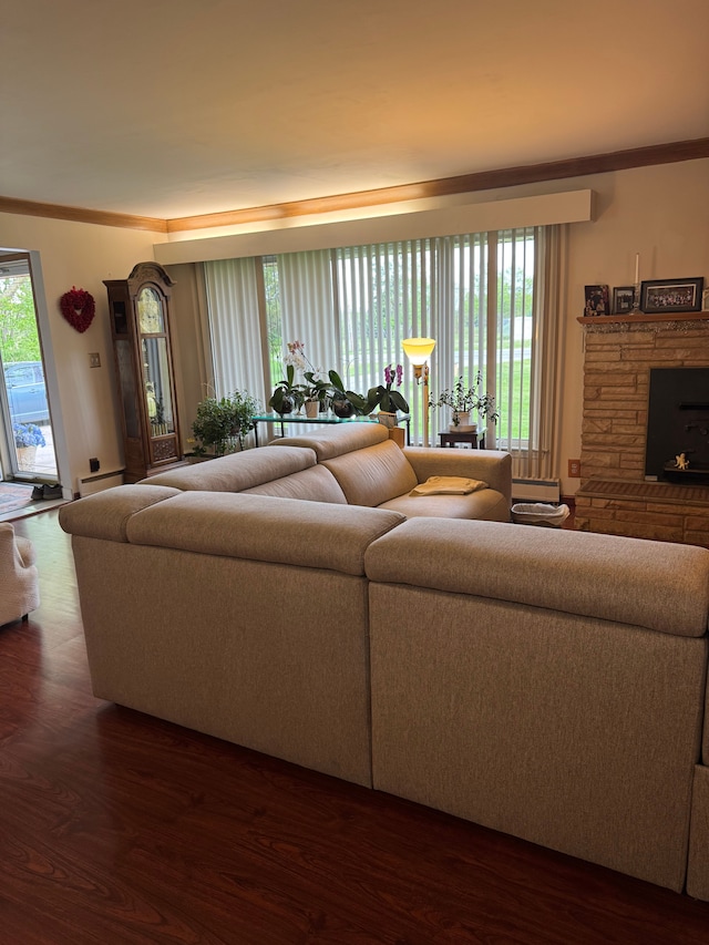 2071 N Belsay Rd, Burton, MI 48509 - living room featuring wood finished floors, a fireplace, baseboard heating, and crown molding