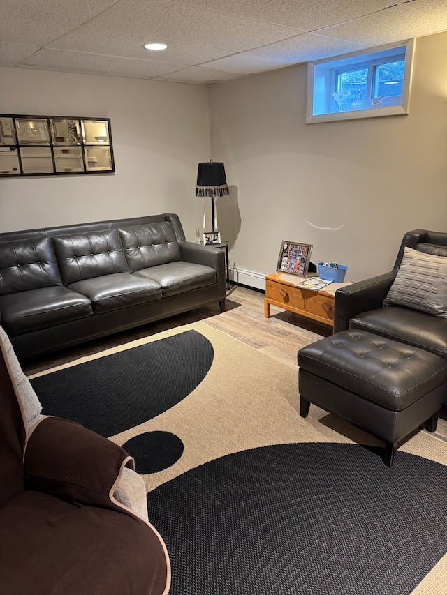 2071 N Belsay Rd, Burton, MI 48509 - living room with wood finished floors and a baseboard heating unit