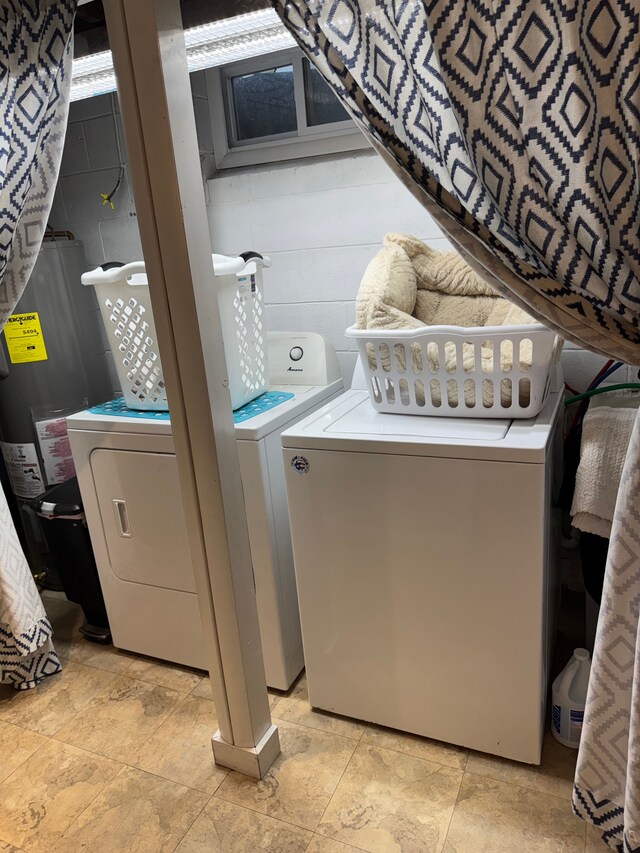 2071 N Belsay Rd, Burton, MI 48509 - laundry area with washing machine and dryer and water heater