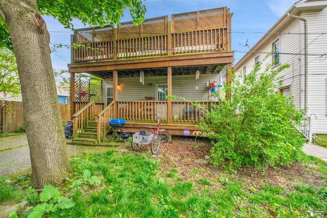 2651 5th St, Trenton, MI 48183 - back of house featuring a wooden deck and fence