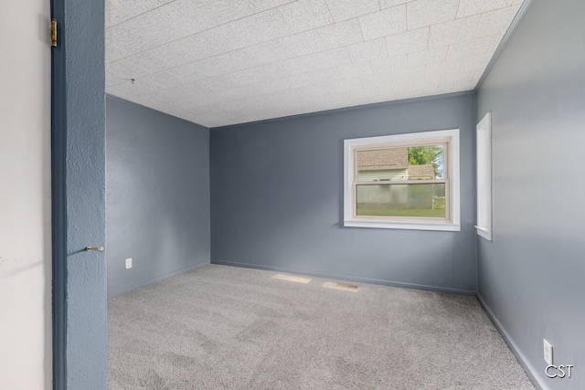 1001 Kelsey Ave, Lansing, MI 48910 - carpeted spare room featuring baseboards
