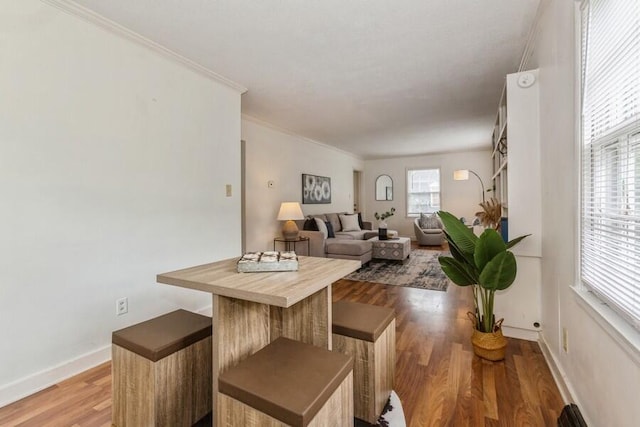2520 S State St, Saint Joseph, MI 49085 - dining area with wood finished floors, baseboards, and ornamental molding