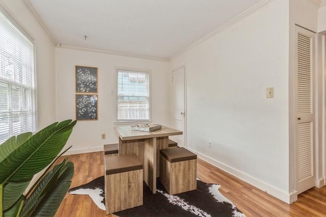 2520 S State St, Saint Joseph, MI 49085 - dining room with ornamental molding, light wood-style flooring, and baseboards