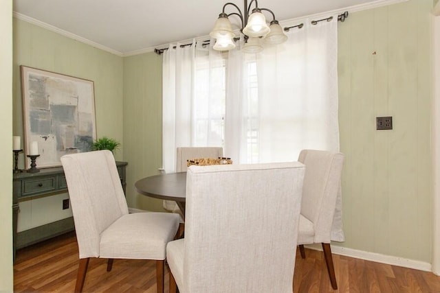 2520 S State St, Saint Joseph, MI 49085 - dining room with a chandelier, wood finished floors, crown molding, and baseboards