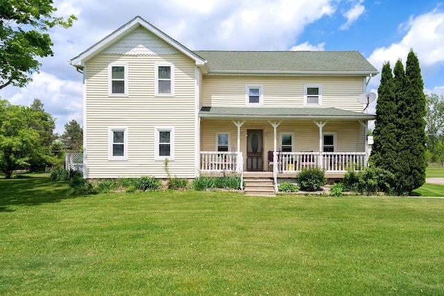 victorian house featuring a porch, a front lawn, and a shingled roof