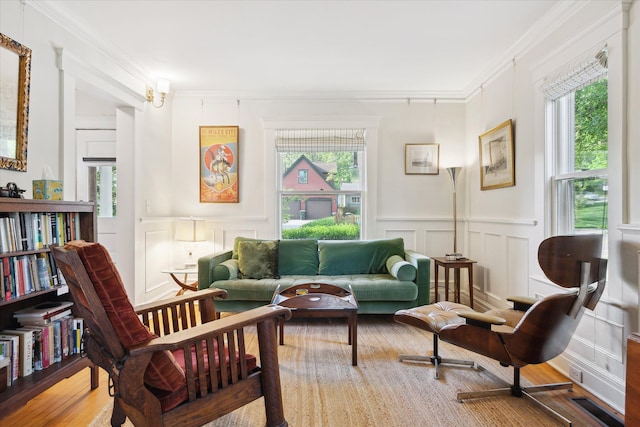 314 W Madison St, Ann Arbor, MI 48103 - living area with a decorative wall, healthy amount of natural light, crown molding, wainscoting, and wood finished floors