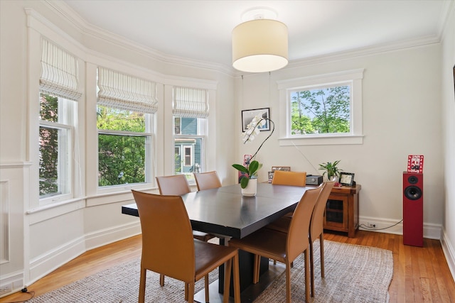 314 W Madison St, Ann Arbor, MI 48103 - dining room featuring healthy amount of natural light, ornamental molding, light wood finished floors, and baseboards