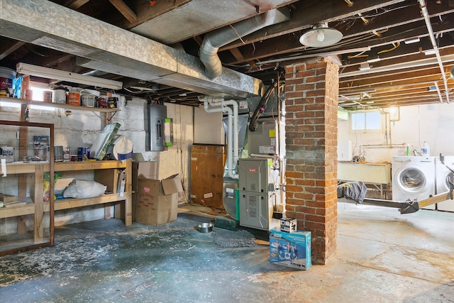 314 W Madison St, Ann Arbor, MI 48103 - below grade area with heating unit, separate washer and dryer, a sink, and electric panel