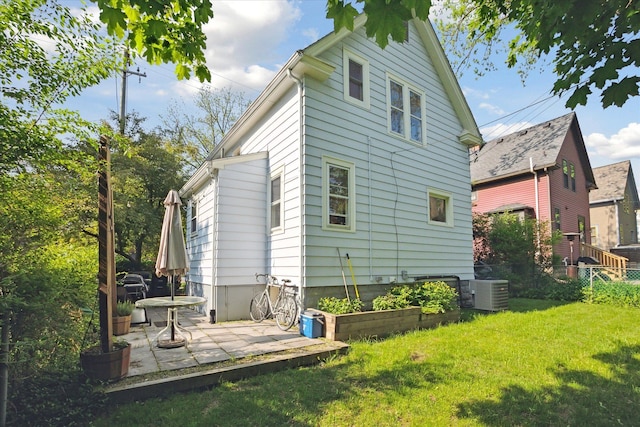 314 W Madison St, Ann Arbor, MI 48103 - back of house with a lawn, a patio, and central air condition unit