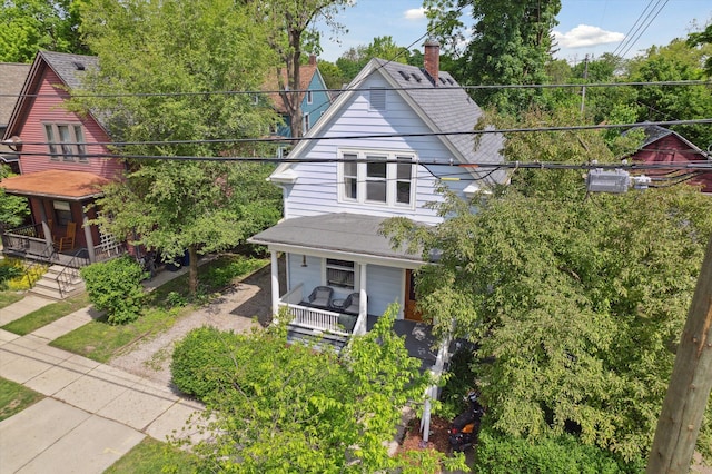 314 W Madison St, Ann Arbor, MI 48103 - view of front of home featuring covered porch, a chimney, and stairway