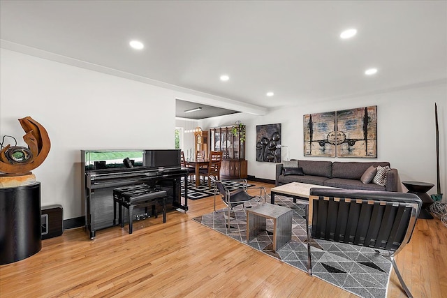 living area with wood finished floors, recessed lighting, and baseboards