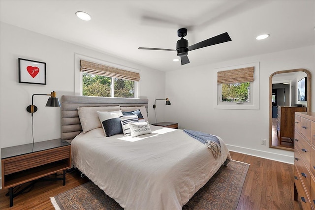 bedroom featuring wood finished floors, recessed lighting, baseboards, and ceiling fan