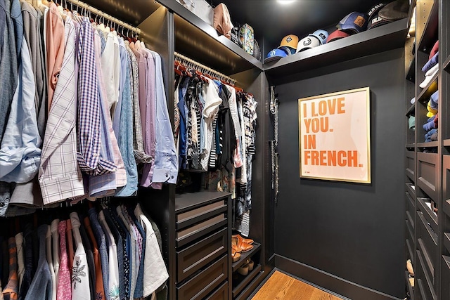 spacious closet featuring light wood-type flooring