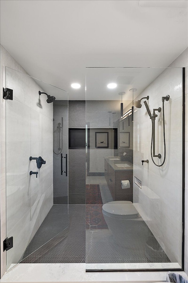 full bath with a shower stall and recessed lighting