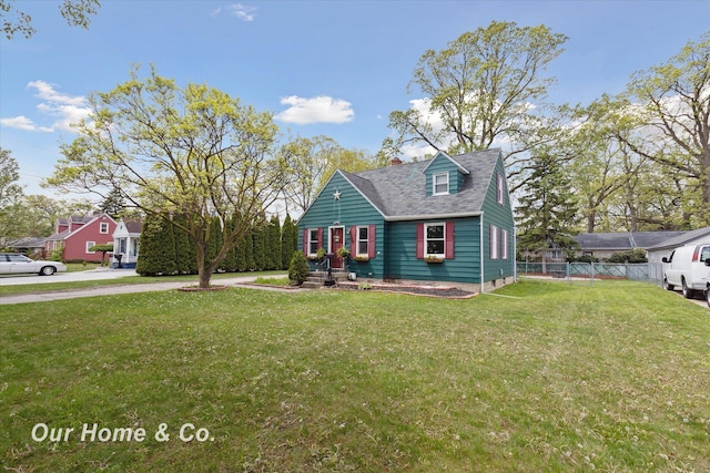 700 Scheurmann St, Essexville, MI 48732 - new england style home with a chimney and roof with shingles
