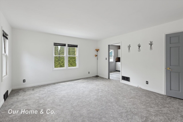 700 Scheurmann St, Essexville, MI 48732 - carpeted spare room featuring baseboards