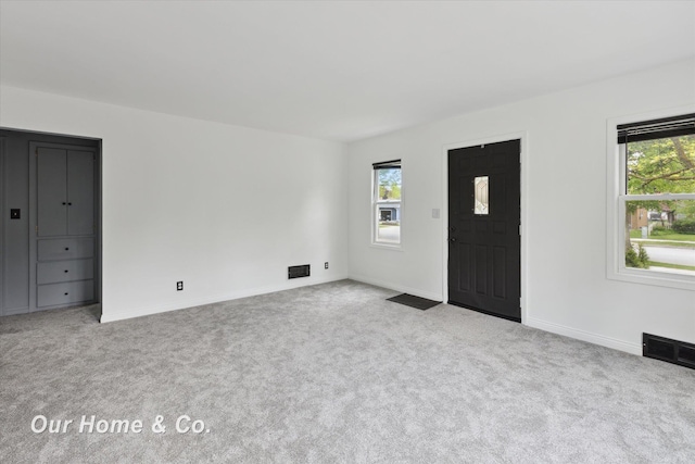 700 Scheurmann St, Essexville, MI 48732 - carpeted foyer entrance with baseboards
