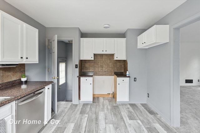 700 Scheurmann St, Essexville, MI 48732 - kitchen featuring dishwasher, white cabinetry, tasteful backsplash, light wood finished floors, and dark stone countertops
