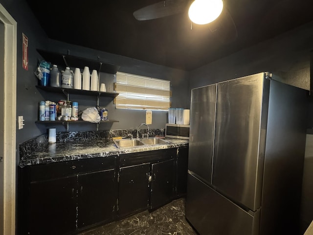 1840 S Averill Ave, Flint, MI 48503 - kitchen featuring freestanding refrigerator, a sink, dark cabinets, open shelves, and ceiling fan