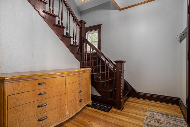 24 W Bernard St, Hartford, MI 49057 - stairway featuring wood finished floors and baseboards