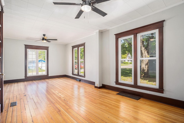24 W Bernard St, Hartford, MI 49057 - spare room featuring a ceiling fan, light wood-type flooring, ornamental molding, and baseboards