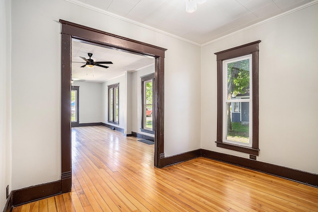 24 W Bernard St, Hartford, MI 49057 - empty room featuring crown molding, light wood-style flooring, and baseboards