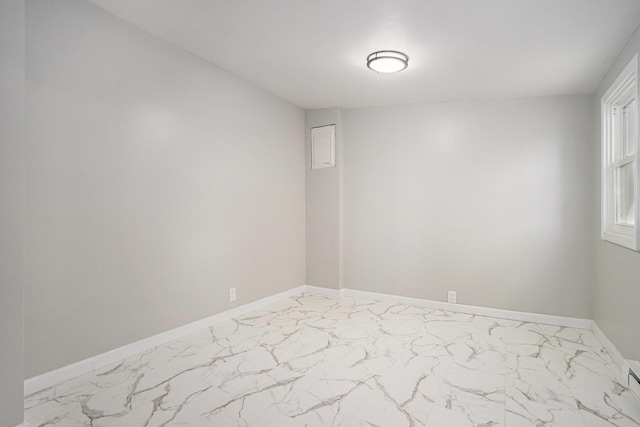 24 W Bernard St, Hartford, MI 49057 - empty room with light marble finish floors and baseboards