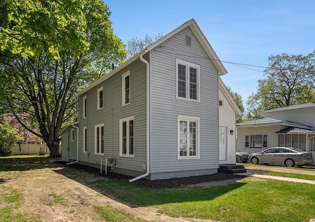 24 W Bernard St, Hartford, MI 49057 - view of side of property featuring a lawn
