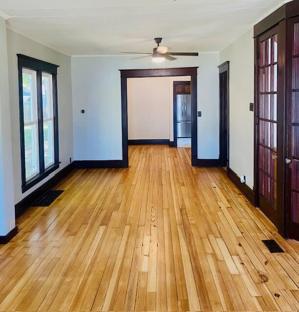 24 W Bernard St, Hartford, MI 49057 - unfurnished room featuring baseboards, light wood-style flooring, and a ceiling fan
