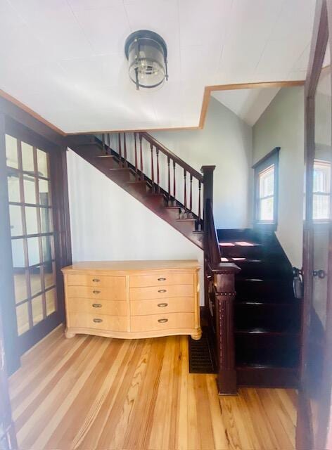 24 W Bernard St, Hartford, MI 49057 - stairway with wood finished floors and vaulted ceiling