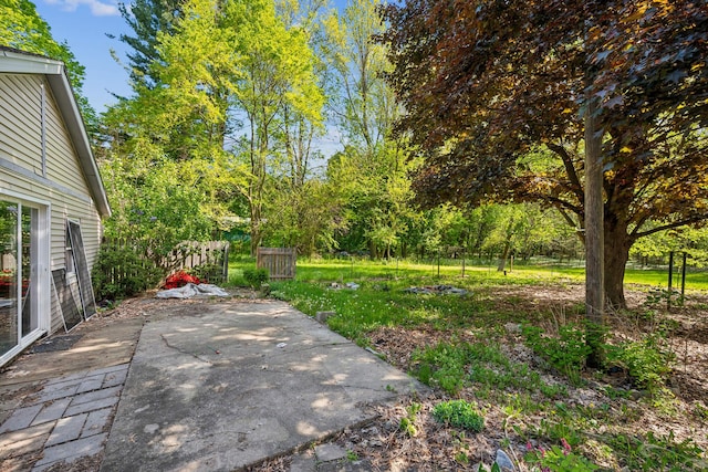 view of yard featuring a patio and fence