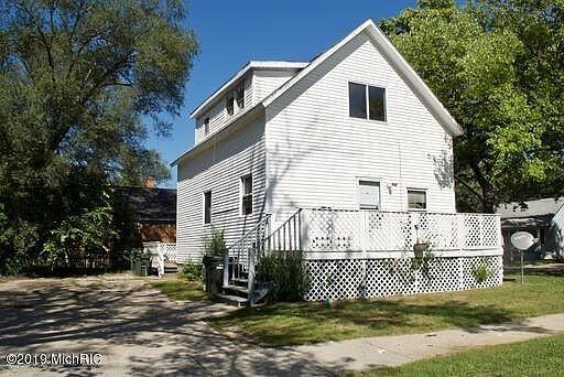 654 E Isabella Ave, Muskegon, MI 49442 - view of property exterior with a wooden deck