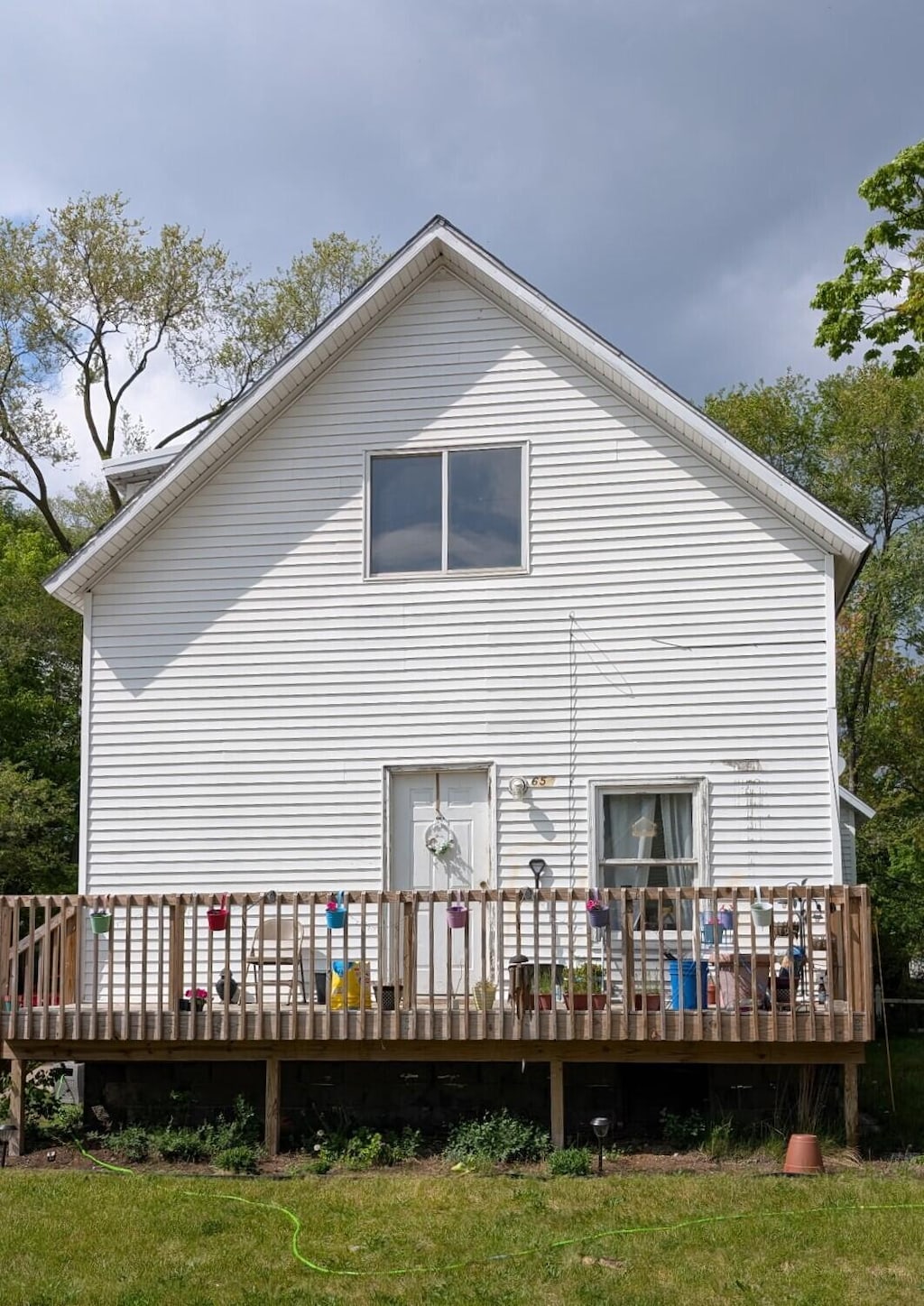 654 E Isabella Ave, Muskegon, MI 49442 - back of house with a wooden deck